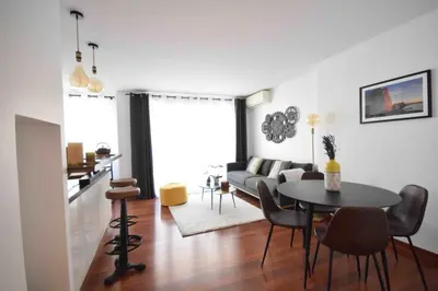 Coin salon dans l'établissement LE CARNOT Apartment for 2 By Sunset