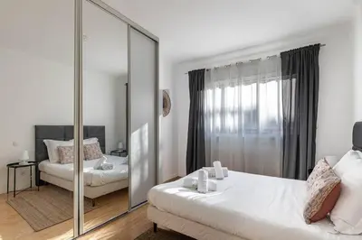 Un ou plusieurs lits dans un hébergement de l'établissement Le Vautrin - Charmant Appartement à 300 mètres des plages de la Croisette