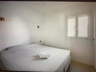 Un ou plusieurs lits dans un hébergement de l'établissement Appartement Avec Terrasse Centre-ville Croisette