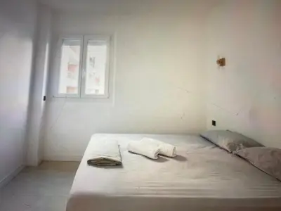 Un ou plusieurs lits dans un hébergement de l'établissement Appartement Avec Terrasse Centre-ville Croisette