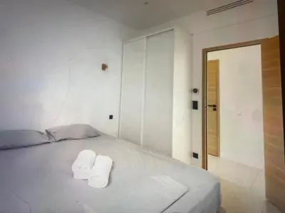 Un ou plusieurs lits dans un hébergement de l'établissement Appartement Avec Terrasse Centre-ville Croisette