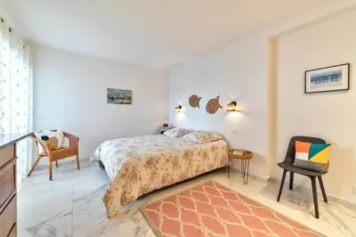 Un ou plusieurs lits dans un hébergement de l'établissement Appartement Reina Pointe Croisette Palm Beach