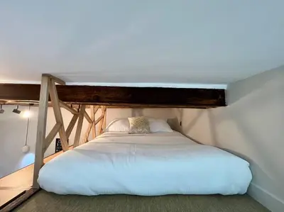 Un ou plusieurs lits dans un hébergement de l'établissement Antibes cute Duplex Studio