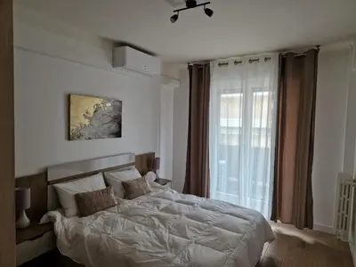 Un ou plusieurs lits dans un hébergement de l'établissement Cozy Home Center of Antibes