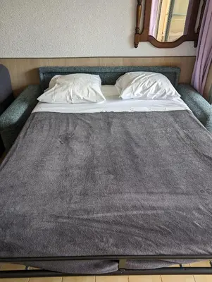 Un ou plusieurs lits dans un hébergement de l'établissement Studio Calme Dernier Etage