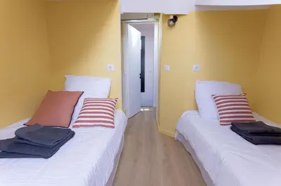 Un ou plusieurs lits dans un hébergement de l'établissement Duplex Pradignac by Halldis