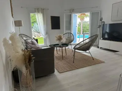 Télévision ou salle de divertissement dans l'établissement Jolie maison familiale