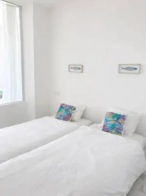 Un ou plusieurs lits dans un hébergement de l'établissement Appartement vue mer piscine à débordement