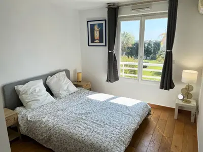 Un ou plusieurs lits dans un hébergement de l'établissement Appartement 84m² avec 2 parkings privatifs