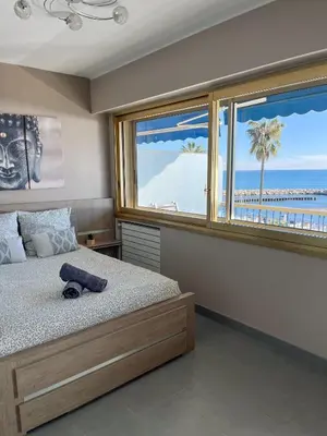 Un ou plusieurs lits dans un hébergement de l'établissement Appartement vue mer