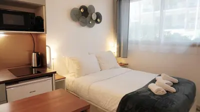 Un ou plusieurs lits dans un hébergement de l'établissement Proche Croisette, Studio moderne by Palmazur Vacances