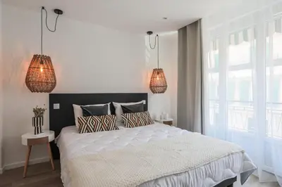 Un ou plusieurs lits dans un hébergement de l'établissement Appartement Ebène - Welkey