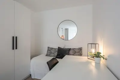 Un ou plusieurs lits dans un hébergement de l'établissement Appartement Ebène - Welkey