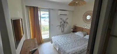 Un ou plusieurs lits dans un hébergement de l'établissement magnifique appartement centre plage