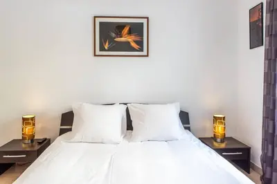 Un ou plusieurs lits dans un hébergement de l'établissement Cannes Branly :2BDR Apartment