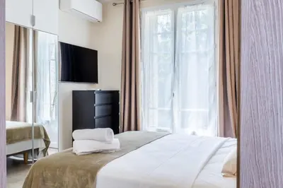 Un ou plusieurs lits dans un hébergement de l'établissement Garden-level apartment 10-min on foot to City Center