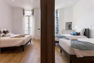 Un ou plusieurs lits dans un hébergement de l'établissement L'Elégance Rue d'Antibes - Palais & Plages - 200 m Croisette - Parking privé - Clim - Wifi