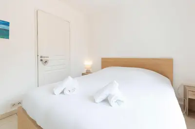 Un ou plusieurs lits dans un hébergement de l'établissement Plaza Antibes one-bedroom apartment with AC