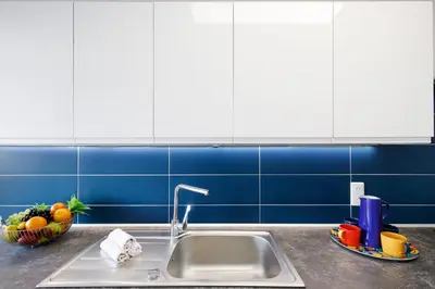 Cuisine ou kitchenette dans l'établissement Palm Beach 3 chambres