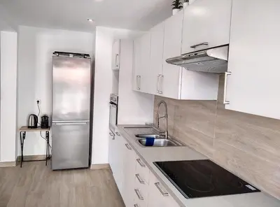 Cuisine ou kitchenette dans l'établissement Residence les Etoiles