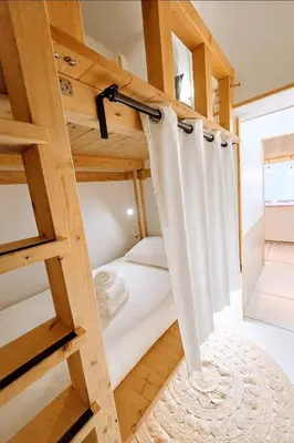 Un ou plusieurs lits dans un hébergement de l'établissement Paradis Côtier 6 couchages