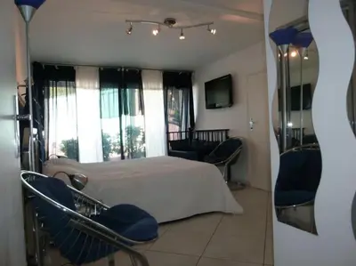 Un ou plusieurs lits dans un hébergement de l'établissement Dans villa spa hammam sauna piscine, 5 chambres