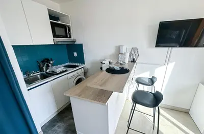 Cuisine ou kitchenette dans l'établissement GUIGNON - Apart sunny comfort close to the Port & Station