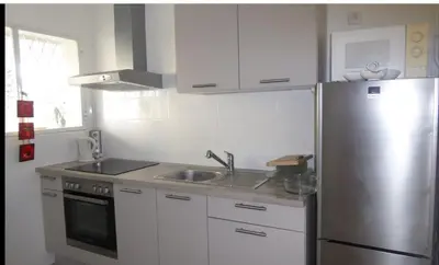 Cuisine ou kitchenette dans l'établissement Le Chantilly