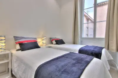Un ou plusieurs lits dans un hébergement de l'établissement Appartement Cannes 4 chambres - 5G