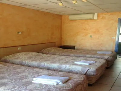 Un ou plusieurs lits dans un hébergement de l'établissement Hostellerie du loup