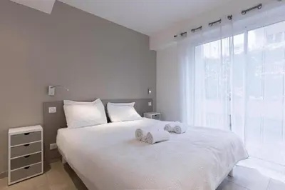 Un ou plusieurs lits dans un hébergement de l'établissement Jardin d'Azur – Terrace, Calm & Croisette