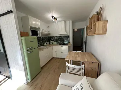 Cuisine ou kitchenette dans l'établissement L'appart idéal famille, terrasse, piscine, plage