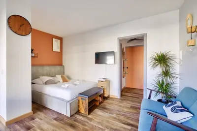Un ou plusieurs lits dans un hébergement de l'établissement Magnifique studio avec terrasse au cœur de Cannes