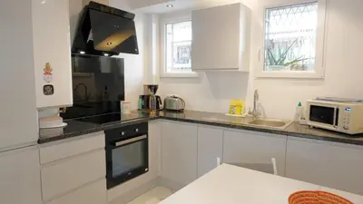 Cuisine ou kitchenette dans l'établissement Proche Centre Ville, T4, Exclusivité Congrès - Palmazur Vacances