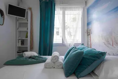 Un ou plusieurs lits dans un hébergement de l'établissement Cannes Bliss - 12mn à pied du Palais, 5mn plages, clim, terrasse
