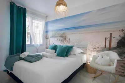 Un ou plusieurs lits dans un hébergement de l'établissement Cannes Bliss - 12mn à pied du Palais, 5mn plages, clim, terrasse
