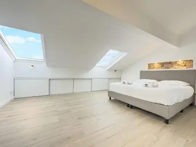 Un ou plusieurs lits dans un hébergement de l'établissement Le Duplex by Winsome Destination
