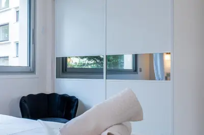 Un ou plusieurs lits dans un hébergement de l'établissement 2-room apartment with terrace close to the center