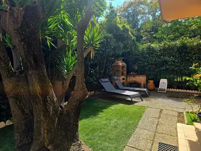 Jardin de l'établissement Duplex climatisé 100m2, jardin, garage individuel clos