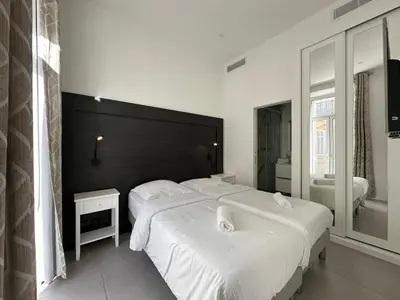 Un ou plusieurs lits dans un hébergement de l'établissement B080- À l'étroit à l'hôtel Bienvenue chez nous