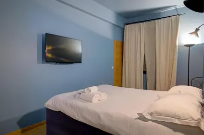 Un ou plusieurs lits dans un hébergement de l'établissement Superbe appartement T5 proche du Palais et de la Croisette