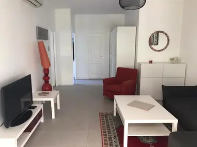 Télévision ou salle de divertissement dans l'établissement Appartement au cœur de Cannes