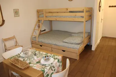 Un ou plusieurs lits dans un hébergement de l'établissement Confort-Appartement cocooning ***