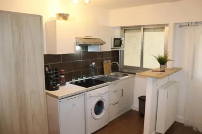 Cuisine ou kitchenette dans l'établissement Confort-Appartement cocooning ***