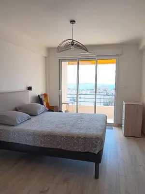 Un ou plusieurs lits dans un hébergement de l'établissement 3 Pièces vue Mer - Clim - 5 Min de la plage à pied