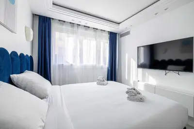 Un ou plusieurs lits dans un hébergement de l'établissement Luxurious Apartment- Croisette-Carré d'Or