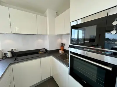 Cuisine ou kitchenette dans l'établissement A013-Apt vue mer avec piscine et terrasse