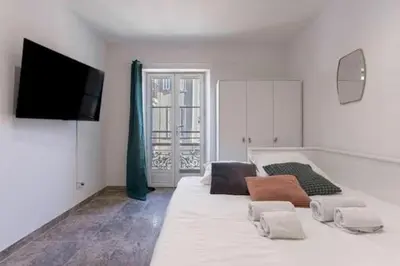 Un ou plusieurs lits dans un hébergement de l'établissement Simon Apartments