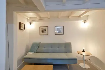 Coin salon dans l'établissement LE PETIT BATEAU - NEW cosy/charming studio/mezzanine for 3 - AC/WIFI