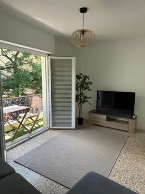 Télévision ou salle de divertissement dans l'établissement Appartement Cannes